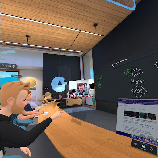 Virtual reality meeting with team members sitting around a table in a virtual setting.
