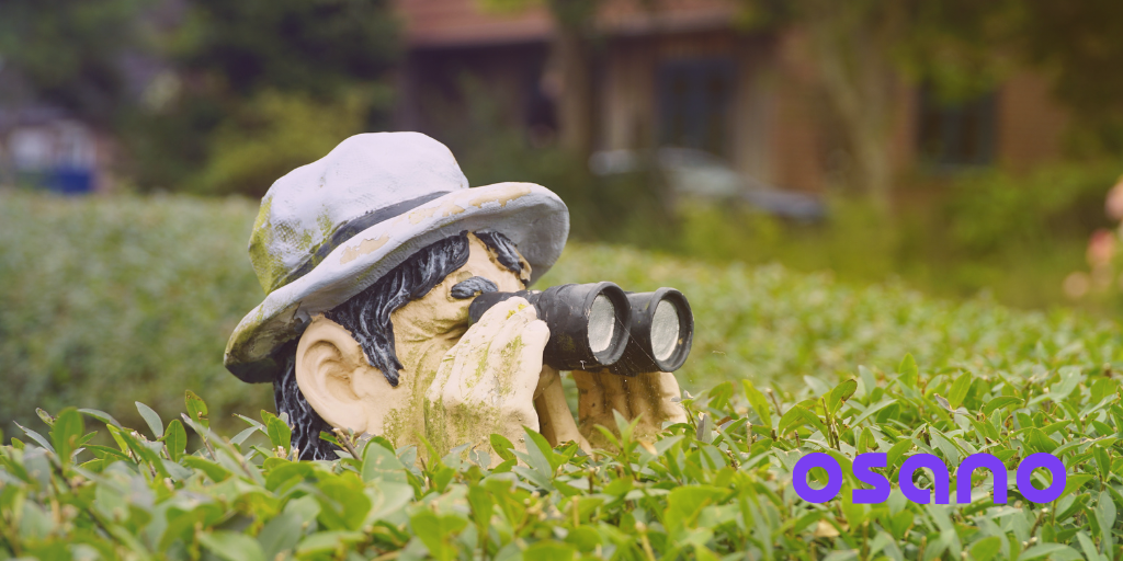 Man in bushes with binoculars