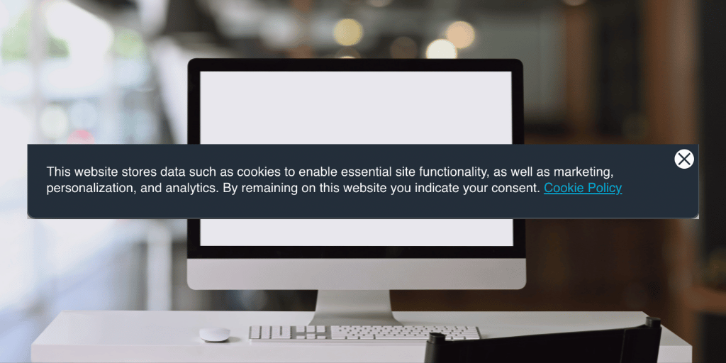 Cookie policy pop up laid over computer screen