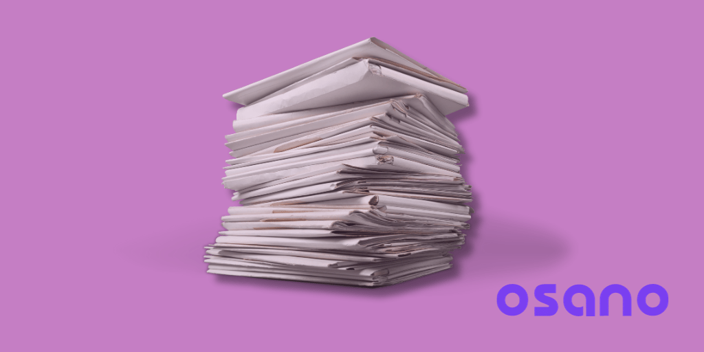 Stack of Papers on a Pink Background