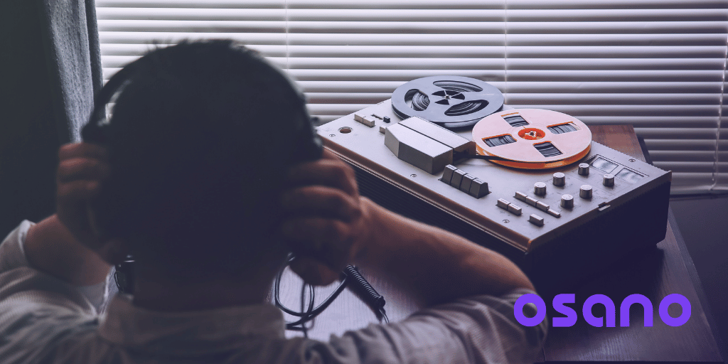 Man listening to tape recorder